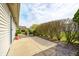 A stone patio extends to a well-groomed yard with lush trees and manicured hedges at 7259 Registry Dr, Indianapolis, IN 46217