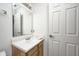 Bathroom with wood vanity and mirror at 7259 Registry Dr, Indianapolis, IN 46217