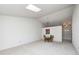 Open dining area with glass-top table and chairs, near kitchen at 7259 Registry Dr, Indianapolis, IN 46217