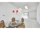 Spacious dining area with glass-top table and wicker chairs at 7259 Registry Dr, Indianapolis, IN 46217