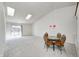 Bright dining area with glass-top table and wicker chairs at 7259 Registry Dr, Indianapolis, IN 46217