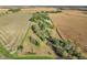 Aerial view of property showing home, trees, and surrounding farmland at 740 S County Road 775 W, Coatesville, IN 46121