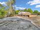 Large backyard with deck, basketball court and trees at 740 S County Road 775 W, Coatesville, IN 46121