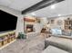 Finished basement with fireplace, sectional sofa, and TV at 740 S County Road 775 W, Coatesville, IN 46121