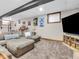 Finished basement with sectional sofa and large TV at 740 S County Road 775 W, Coatesville, IN 46121