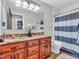 Bathroom with double vanity, granite countertop, and shower at 740 S County Road 775 W, Coatesville, IN 46121