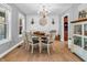 Farmhouse-style dining room with shiplap walls and chandelier at 740 S County Road 775 W, Coatesville, IN 46121