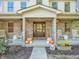 Inviting front porch with rocking chairs and autumnal decorations at 740 S County Road 775 W, Coatesville, IN 46121