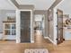 Bright hallway with hardwood floors and access to living areas at 740 S County Road 775 W, Coatesville, IN 46121