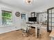 Home office with built-in desk and hardwood floors at 740 S County Road 775 W, Coatesville, IN 46121