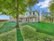 Two story brick house with rocking chairs on front porch at 740 S County Road 775 W, Coatesville, IN 46121