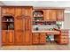 Kitchen with built-in desk and extensive wood cabinetry at 740 S County Road 775 W, Coatesville, IN 46121