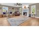 Cozy living room with fireplace, hardwood floors, and large windows at 740 S County Road 775 W, Coatesville, IN 46121
