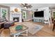 Spacious living room featuring a fireplace, hardwood floors, and large TV at 740 S County Road 775 W, Coatesville, IN 46121