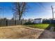 Spacious backyard includes a storage shed and fence, creating a comfortable and private outdoor space at 8415 E 10Th St, Indianapolis, IN 46219