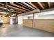 Unfinished basement area with high ceilings and built-in bar at 8415 E 10Th St, Indianapolis, IN 46219