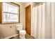 Clean bathroom with wood vanity and shower/tub at 8415 E 10Th St, Indianapolis, IN 46219