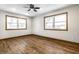 Spacious bedroom with hardwood floors and ceiling fan at 8415 E 10Th St, Indianapolis, IN 46219