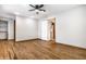 Hardwood floors and neutral walls in this bedroom at 8415 E 10Th St, Indianapolis, IN 46219