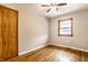 Simple bedroom with hardwood floors and closet at 8415 E 10Th St, Indianapolis, IN 46219