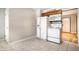 Kitchen with white appliances and wood cabinets at 8415 E 10Th St, Indianapolis, IN 46219