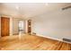 Bright living room with hardwood floors and doors at 8415 E 10Th St, Indianapolis, IN 46219
