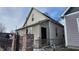Tan house side view with black fence and brick pillars; winter scene at 952 Udell St, Indianapolis, IN 46208