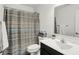 Well-lit bathroom featuring a stylish shower curtain and modern vanity with sink at 977 Capricorn Dr, Franklin, IN 46131