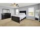 Bright bedroom with dark furniture, neutral walls, and plenty of natural light at 977 Capricorn Dr, Franklin, IN 46131