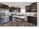 Beautiful kitchen featuring stainless steel appliances and an island with wine glass storage at 977 Capricorn Dr, Franklin, IN 46131