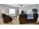 Inviting living room featuring comfortable seating, a TV, and a large window at 977 Capricorn Dr, Franklin, IN 46131