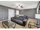 Comfortable living room with carpet flooring, fan, and two entryways at 977 Capricorn Dr, Franklin, IN 46131
