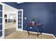 Inviting office featuring blue walls, carpeted floors, and view of the kitchen at 977 Capricorn Dr, Franklin, IN 46131