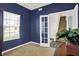 Comfortable office space with blue walls, natural light, and a view of the stairway at 977 Capricorn Dr, Franklin, IN 46131