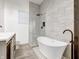 Modern bathroom with double vanity, freestanding tub, and shower at 1022 Villa Ave, Indianapolis, IN 46203