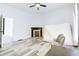 Bright bedroom with hardwood floors, fireplace and large windows at 1022 Villa Ave, Indianapolis, IN 46203