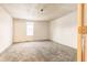 Simple bedroom with grey carpet and window at 1022 Villa Ave, Indianapolis, IN 46203