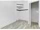 Spacious bedroom with hardwood floors and built-in shelving at 1022 Villa Ave, Indianapolis, IN 46203