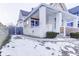 White house with wood details, covered porch, and walkway, snow on the ground at 1022 Villa Ave, Indianapolis, IN 46203