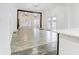 Open concept living room with hardwood floors, and view to kitchen at 1022 Villa Ave, Indianapolis, IN 46203