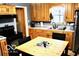 Eat-in kitchen with wood cabinets and a double sink at 120 Hoss Rd, Indianapolis, IN 46217