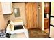 Laundry room with washer, dryer and barn door at 120 Hoss Rd, Indianapolis, IN 46217