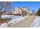 Brick and siding house with attached two car garage and driveway at 14027 Honey Tree Dr, Carmel, IN 46032