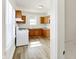 Bright kitchen featuring wood cabinets, vinyl flooring and updated appliances at 1503 N Grant Ave, Indianapolis, IN 46201