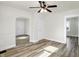 Bright living room with wood-look floors and white walls at 1503 N Grant Ave, Indianapolis, IN 46201