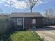 Small shed with peeling paint, needing some maintenance at 1520 N Bancroft St, Indianapolis, IN 46201