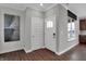 Modern entryway with hardwood floors, white door, and contemporary art at 166 Cline St, Westfield, IN 46074