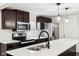 Modern kitchen with stainless steel appliances and quartz countertops at 1821 N Dequincy St, Indianapolis, IN 46218