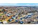 Expansive aerial view showcasing a charming residential area with a mix of homes and fall foliage under a clear blue sky at 201 S Mckinley St, North Salem, IN 46165