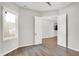 Finished basement room with wood-look flooring and access to other rooms at 201 S Mckinley St, North Salem, IN 46165